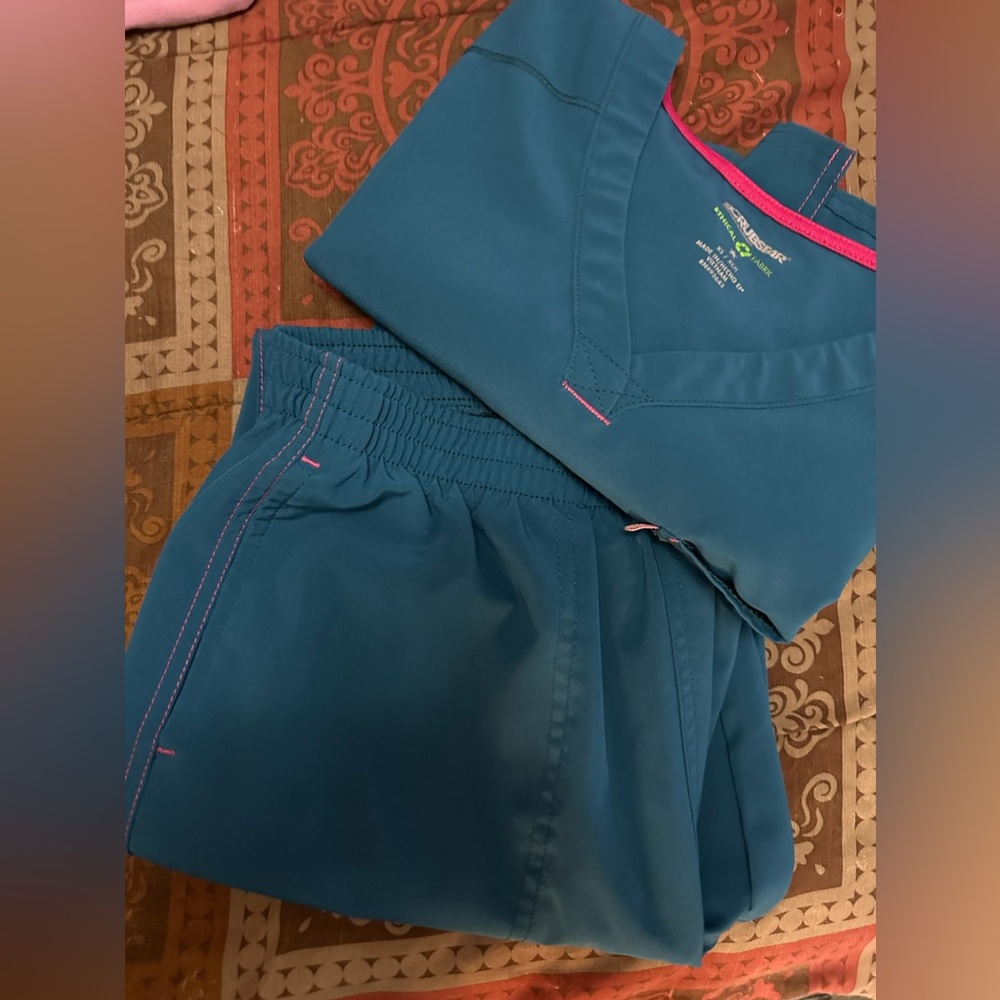 Two sets of jogger medical scrubs
